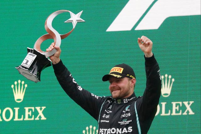 <p>Valtteri Bottas celebrates his first race win of the season</p>