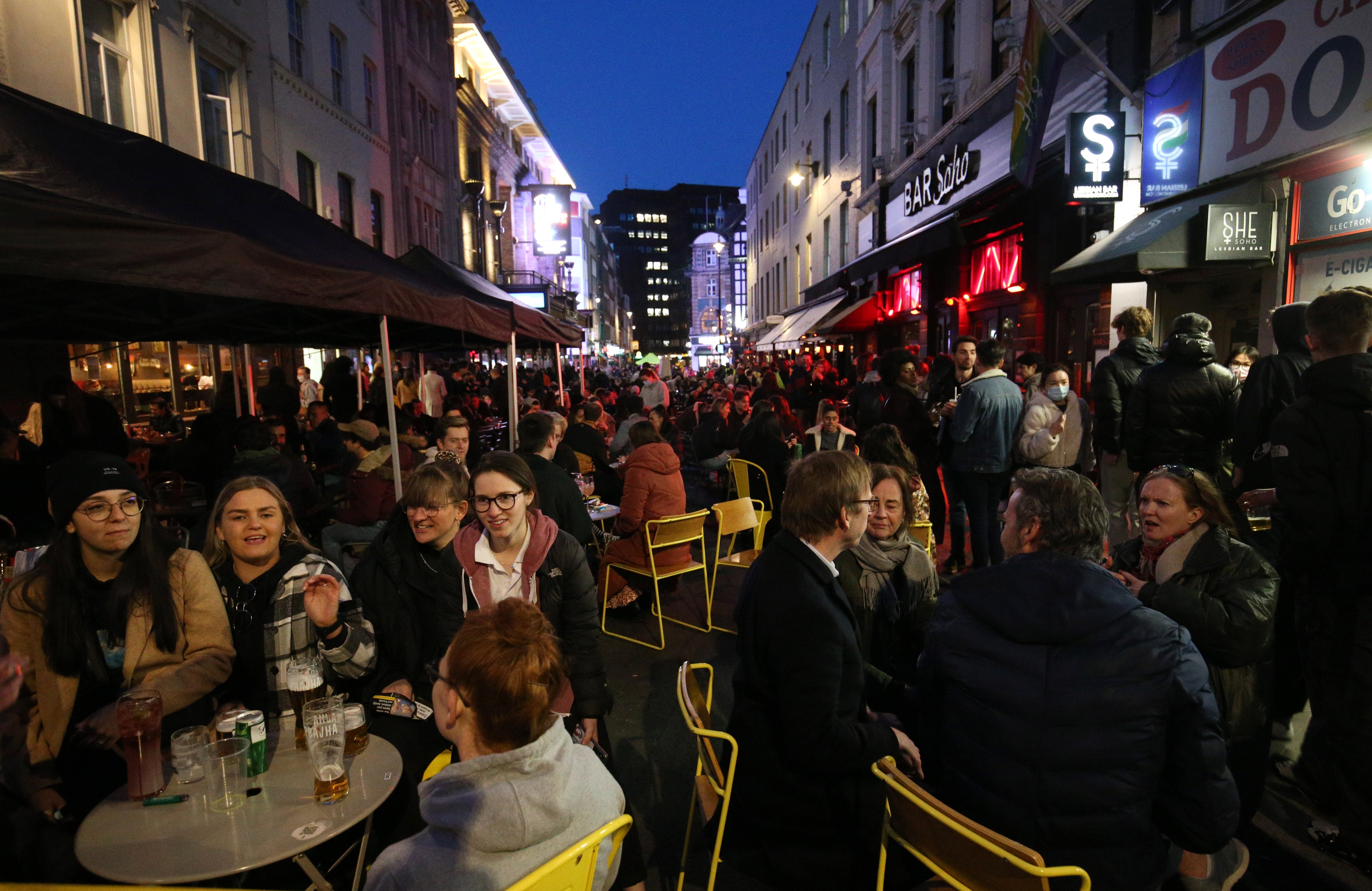 People gather for drinks and food in Old Compton Street, Soho, central London (Jonathan Brady/PA)