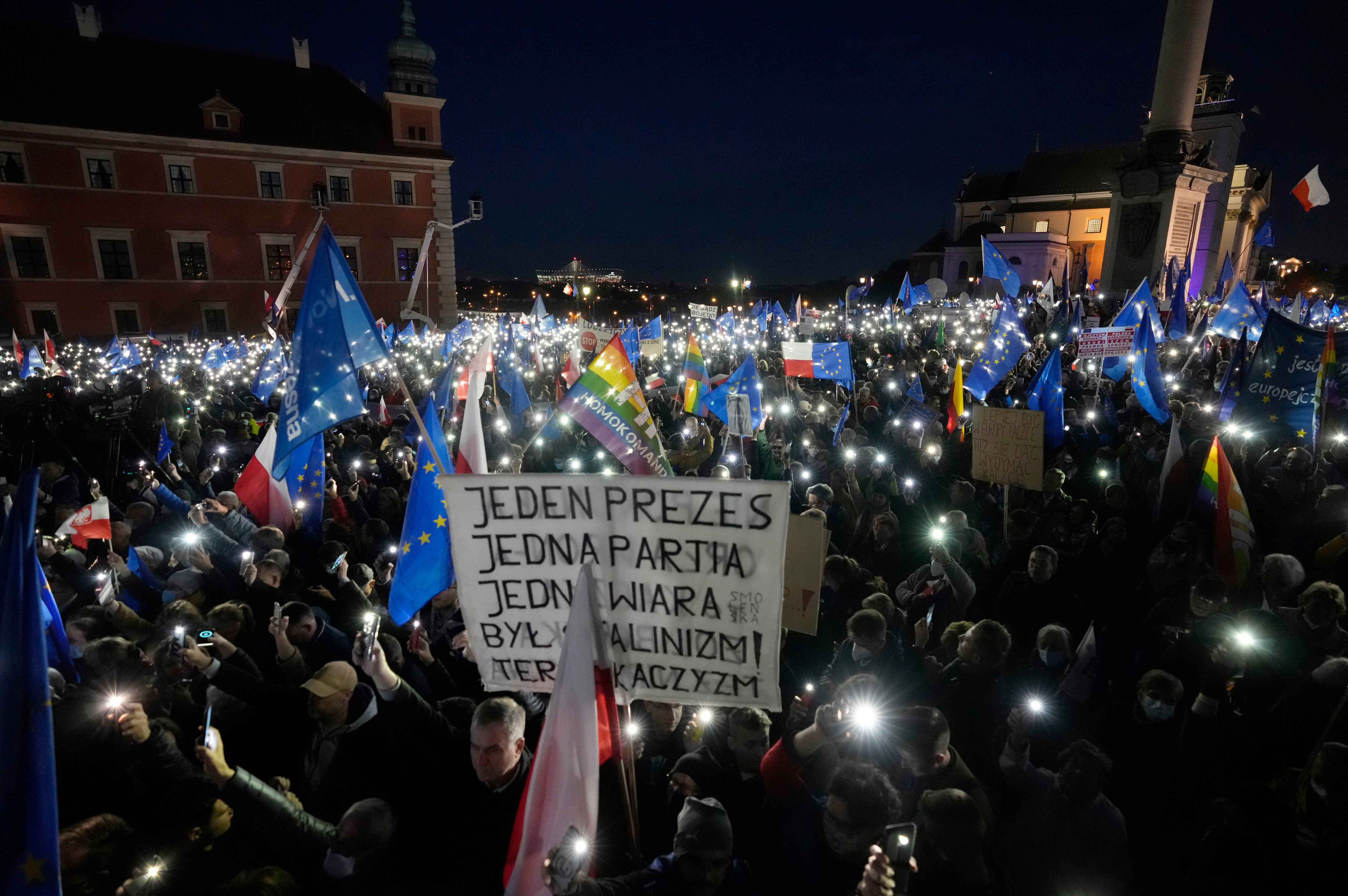 <p>One protester holds up a sign that reads: ‘One leader, one party, one creed. Once it was Stalinism, now it it’s Kaczynski-ism’ </p>