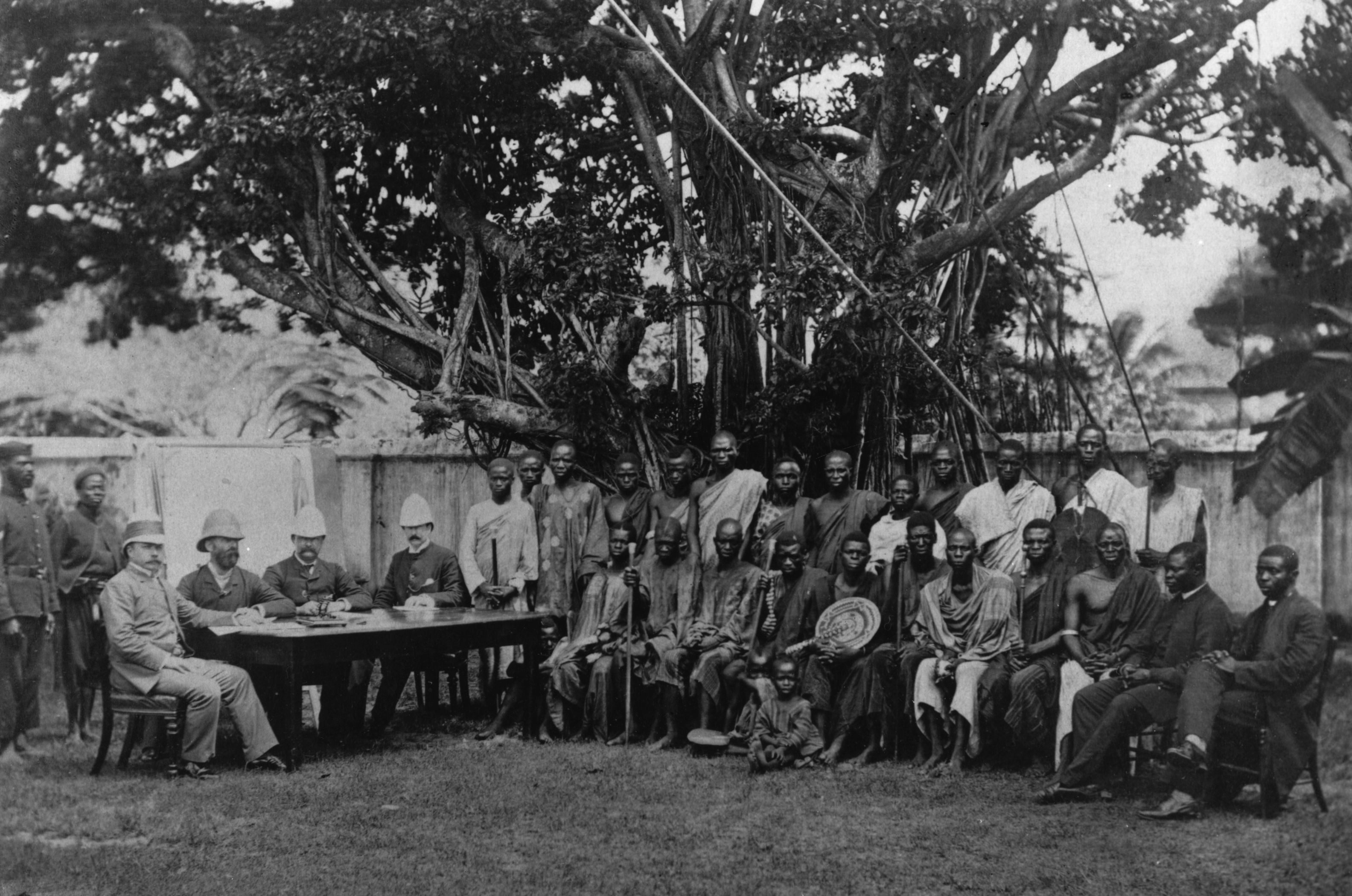 Colonial administrators in Lagos, Nigeria, with messengers from the interior
