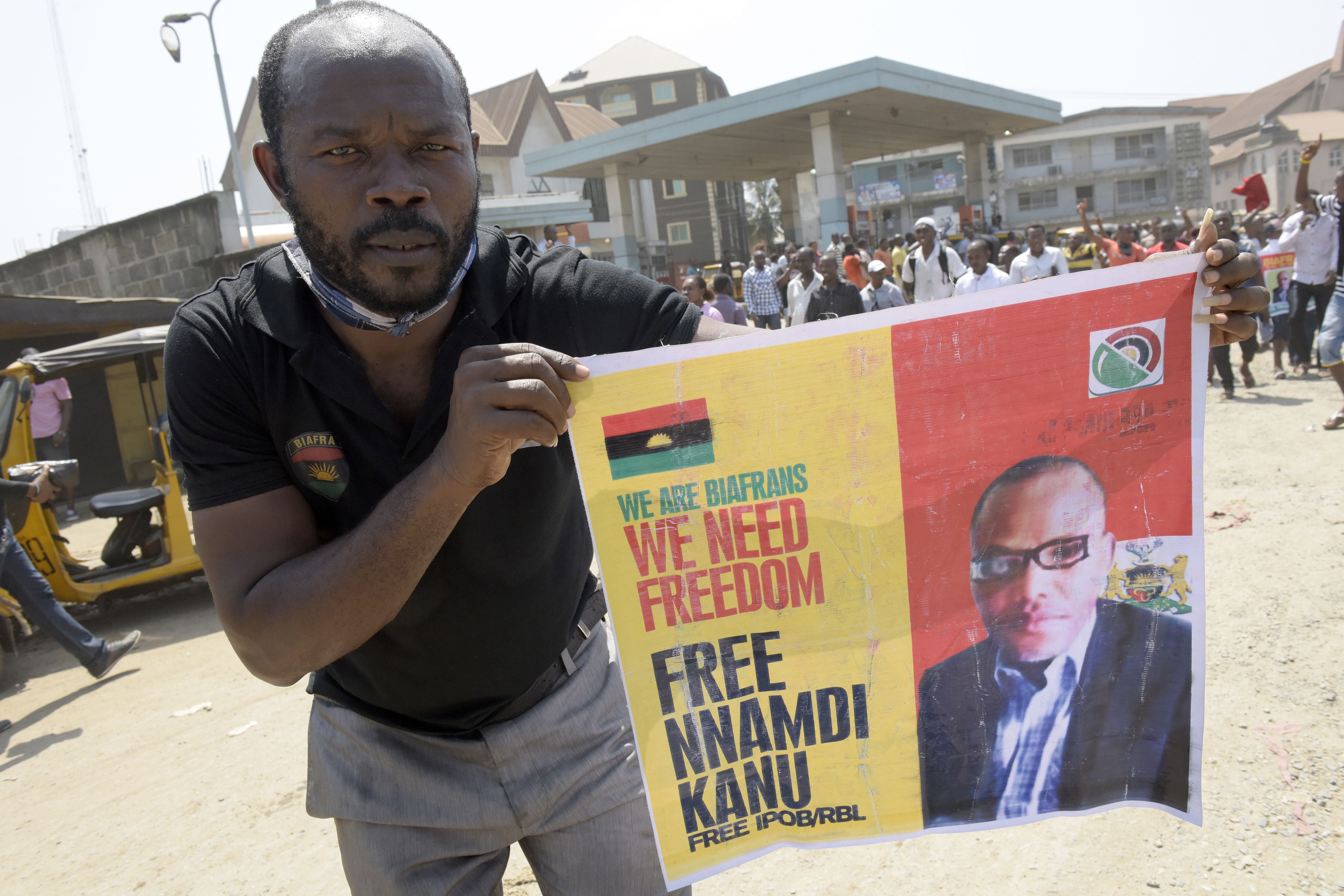 A pro-Biafra supporter holds a poster of jailed activist Kanu