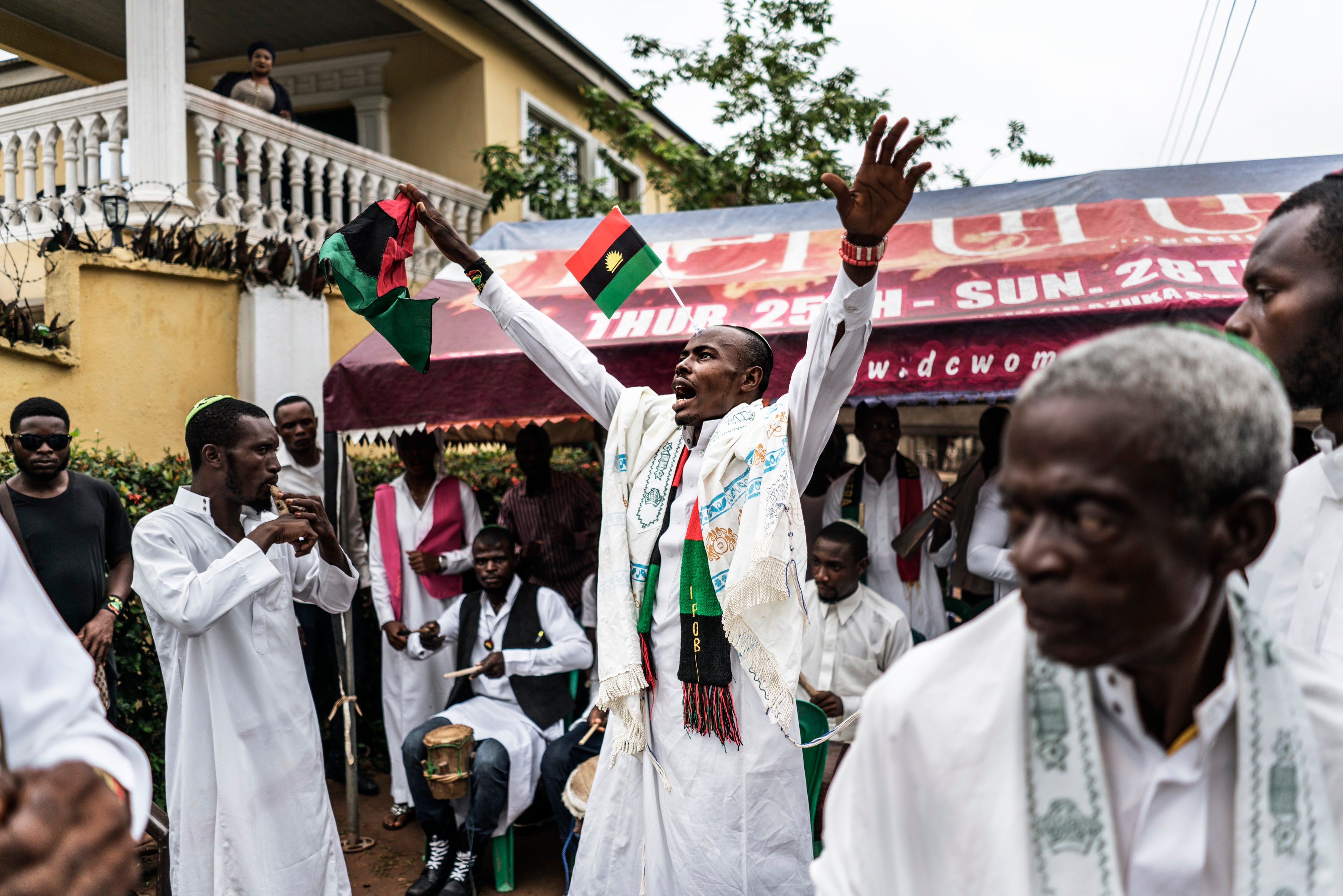 An Ipob supporter joins members of the Yahveh Yashua synagogue celebrating Shabbat outside the residence of the movement's leader Kanu in Umuahia