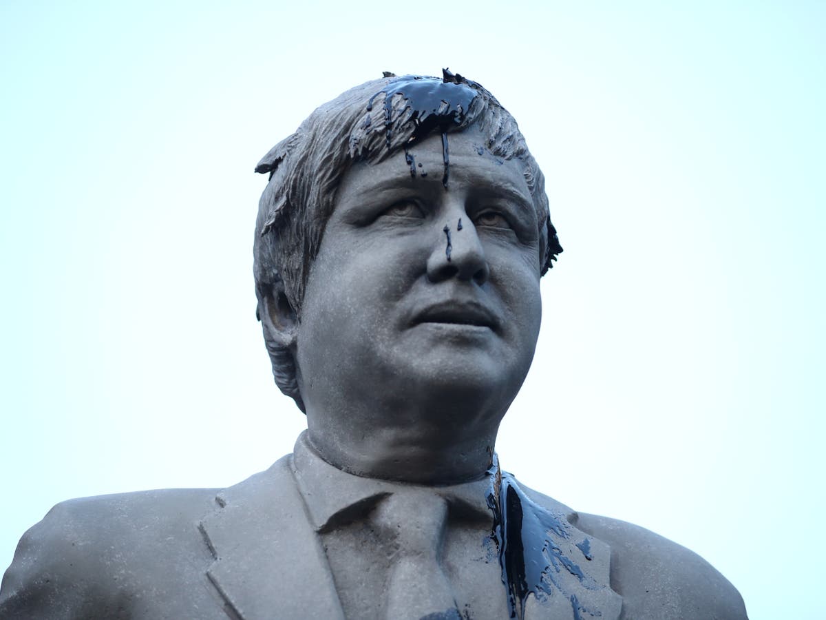 Greenpeace blocks Whitehall with oil-covered statue of Boris Johnson