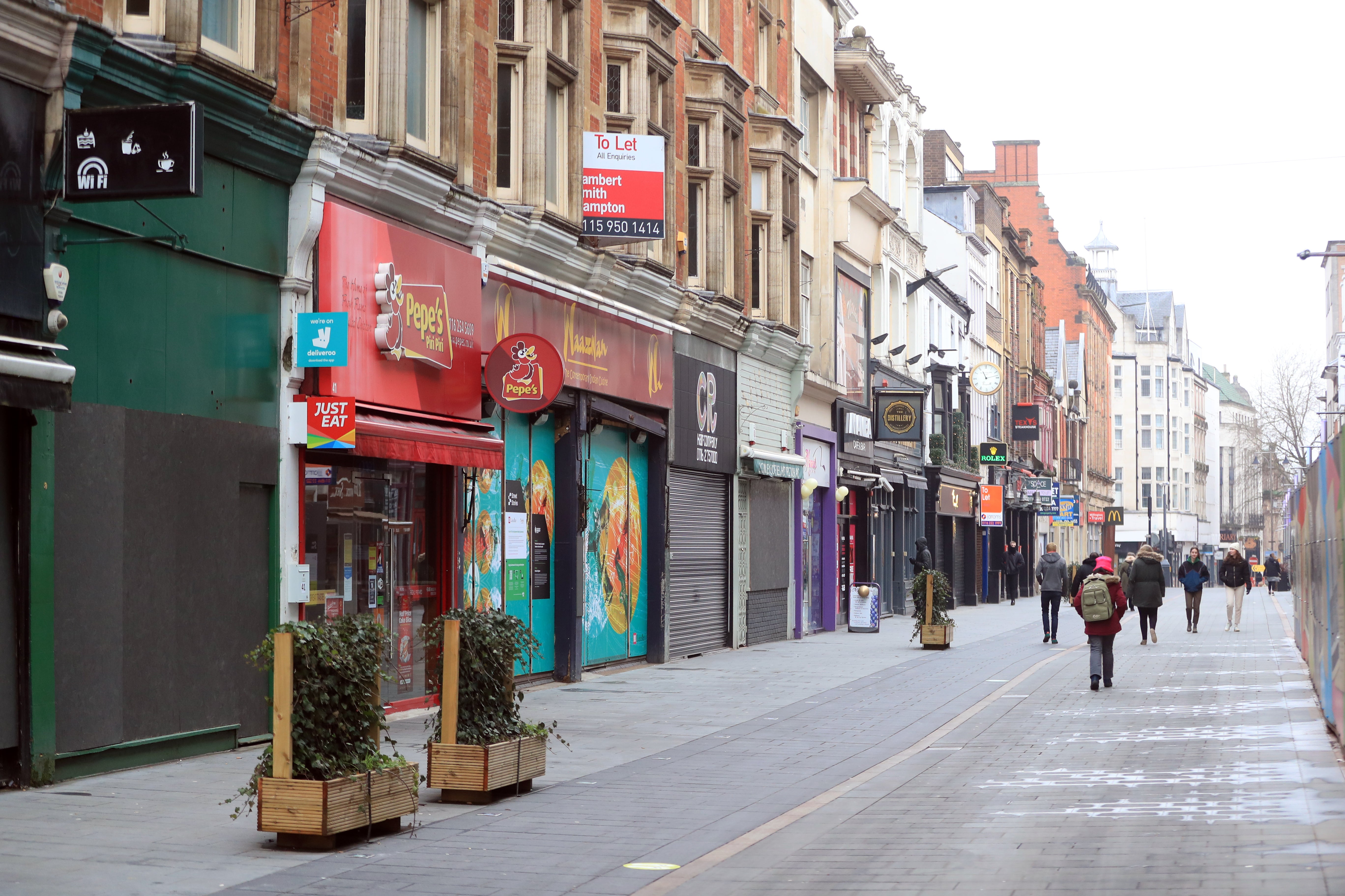 Closed shops during the winter lockdown on Leicester High Street. (PA)
