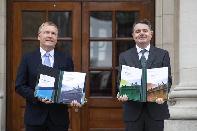 Minister for Finance Paschal Donohoe (right) and Minister for Public Expenditure and Reform Michael McGrath arrive at Government Buildings to unveil the Government’s Budget for 2022 (Damien Eagers/PA)