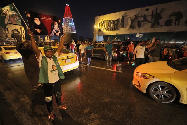 <p>Supporters of Iraqi Shia cleric Muqtada al-Sadr celebrate in Baghdad’s Tahrir Square </p>