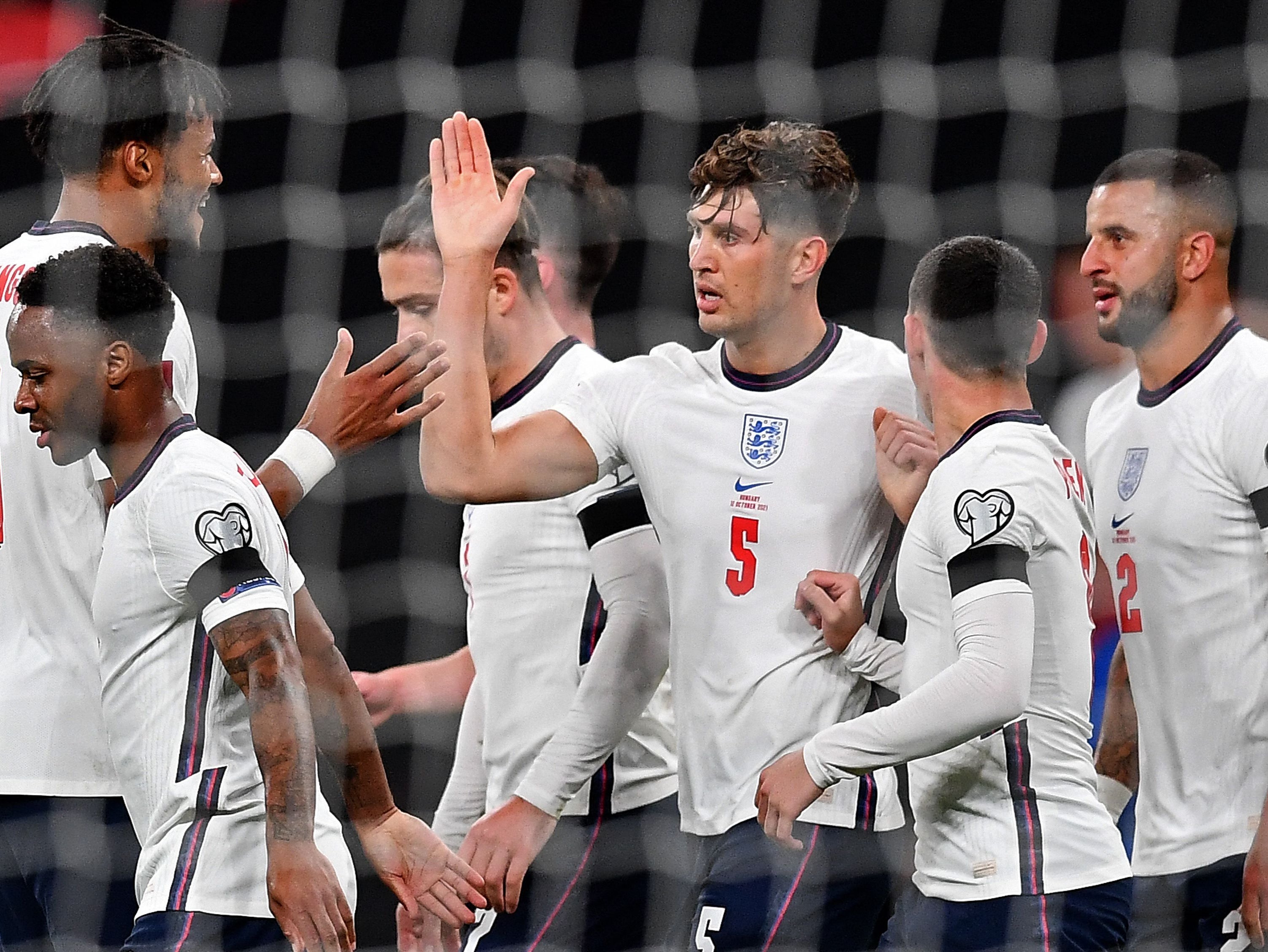 England players celebrate John Stones’ (centre) equaliser