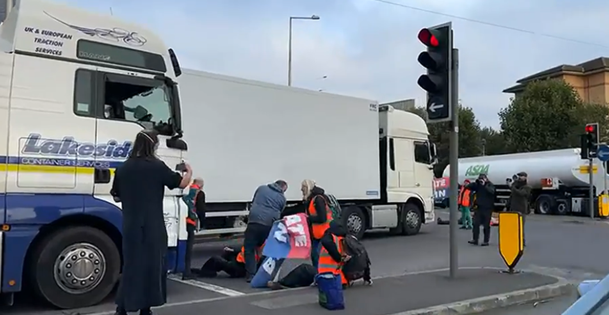 Insulate Britain protesters dragged off roads by furious lorry drivers amid supply chain crisis