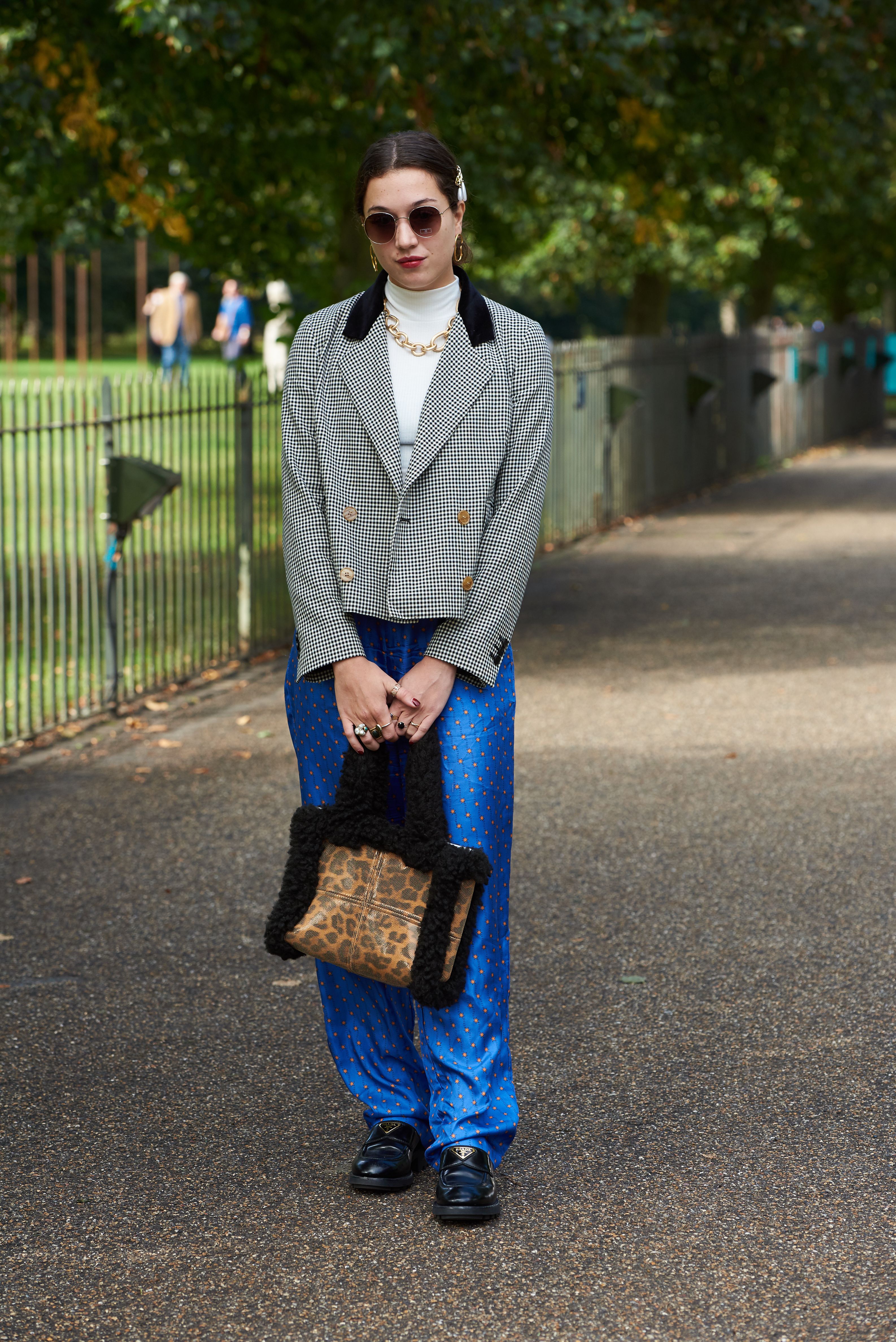The handbag and the trousers were both rented from Hurr, pictured here at London Fashion Week.