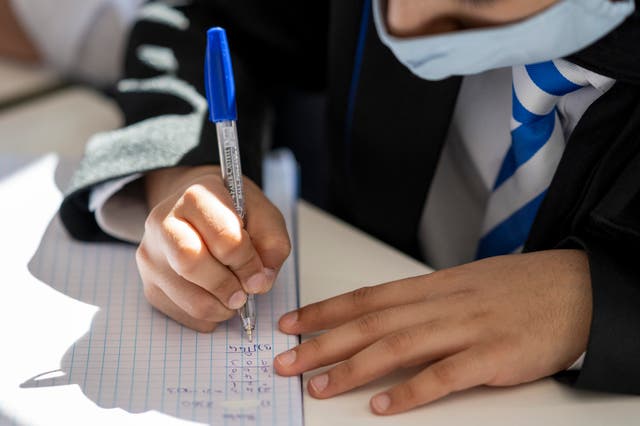 <p>A child learning during a maths class at Llanishen High School in Cardiff, Wales</p>