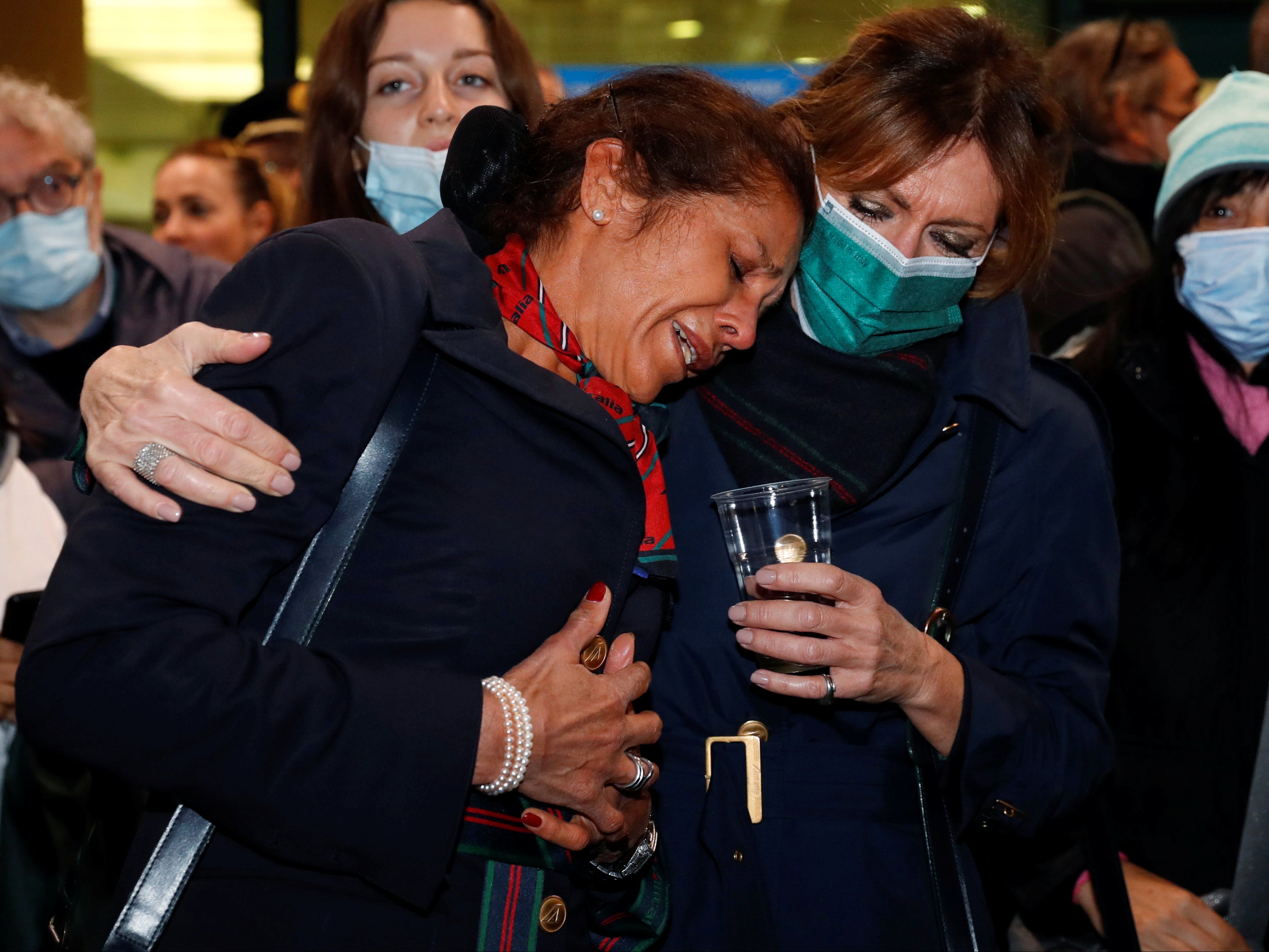 Alitalia workers after its last ever flight landed in Rome Fiumicino