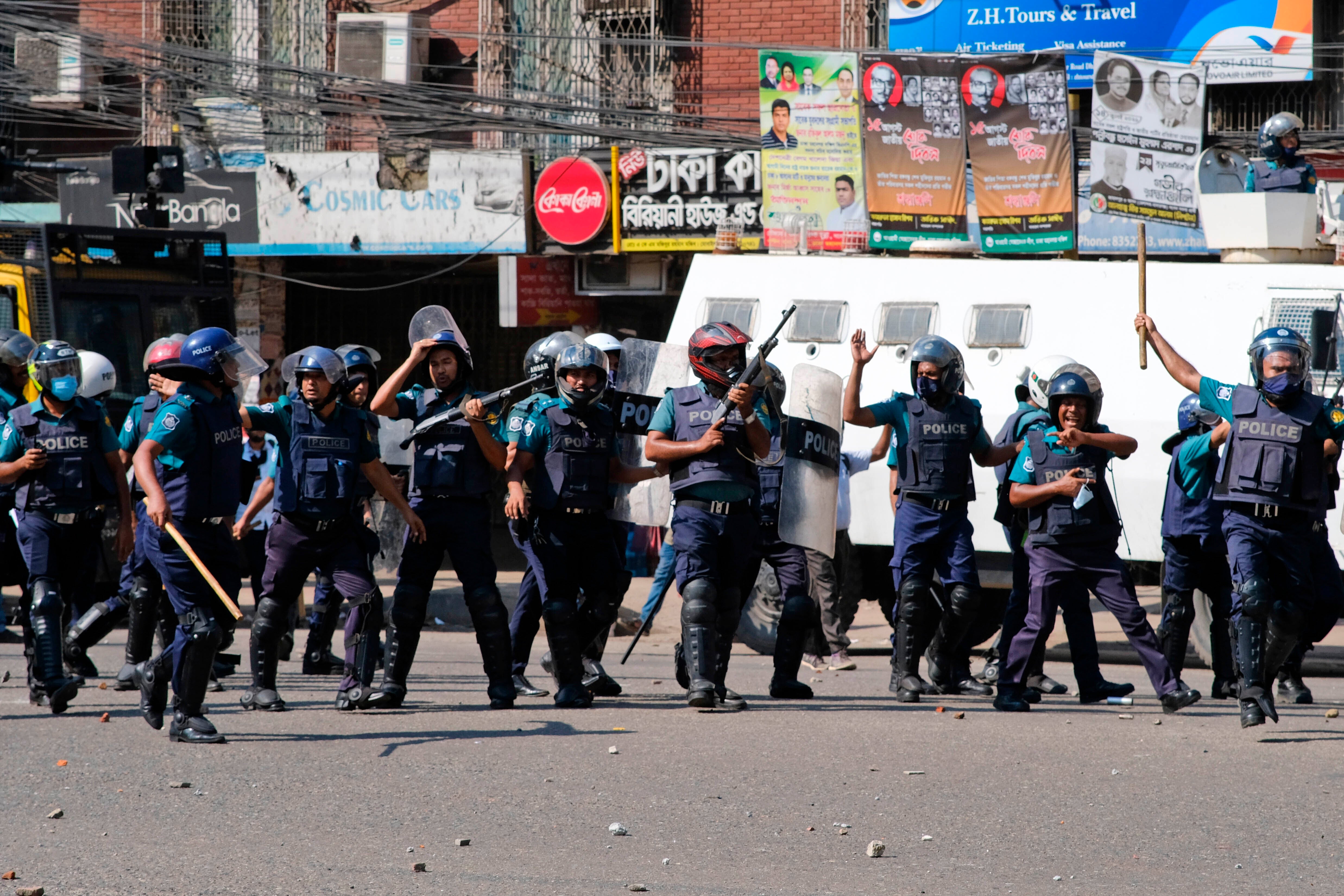 Police clash with Muslim devotees during a protest over an alleged insult to Islam, outside the country’ main Baitul Mukarram Mosque in Dhaka