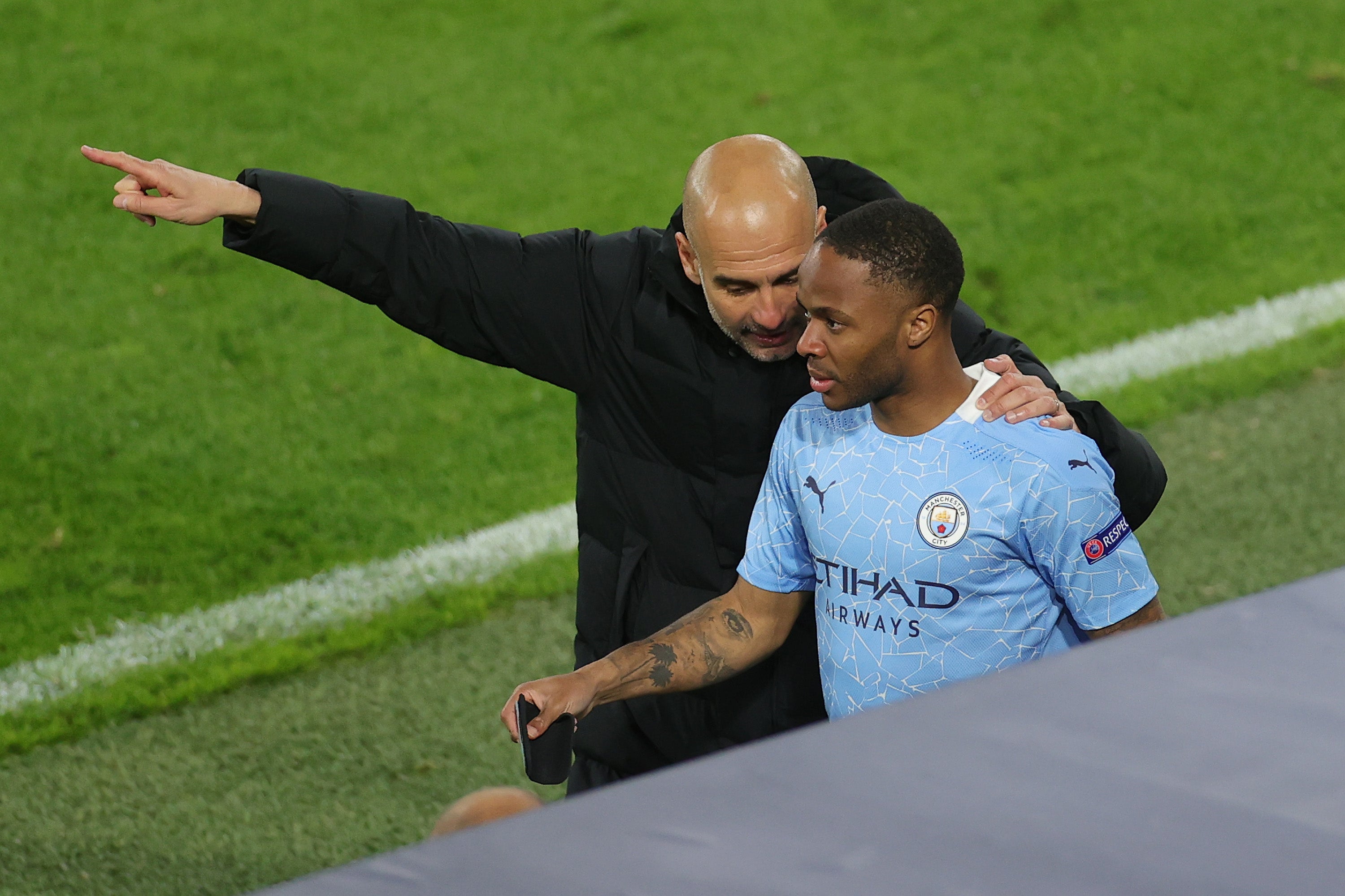 Manchester City winger Raheem Sterling and manager Pep Guardiola