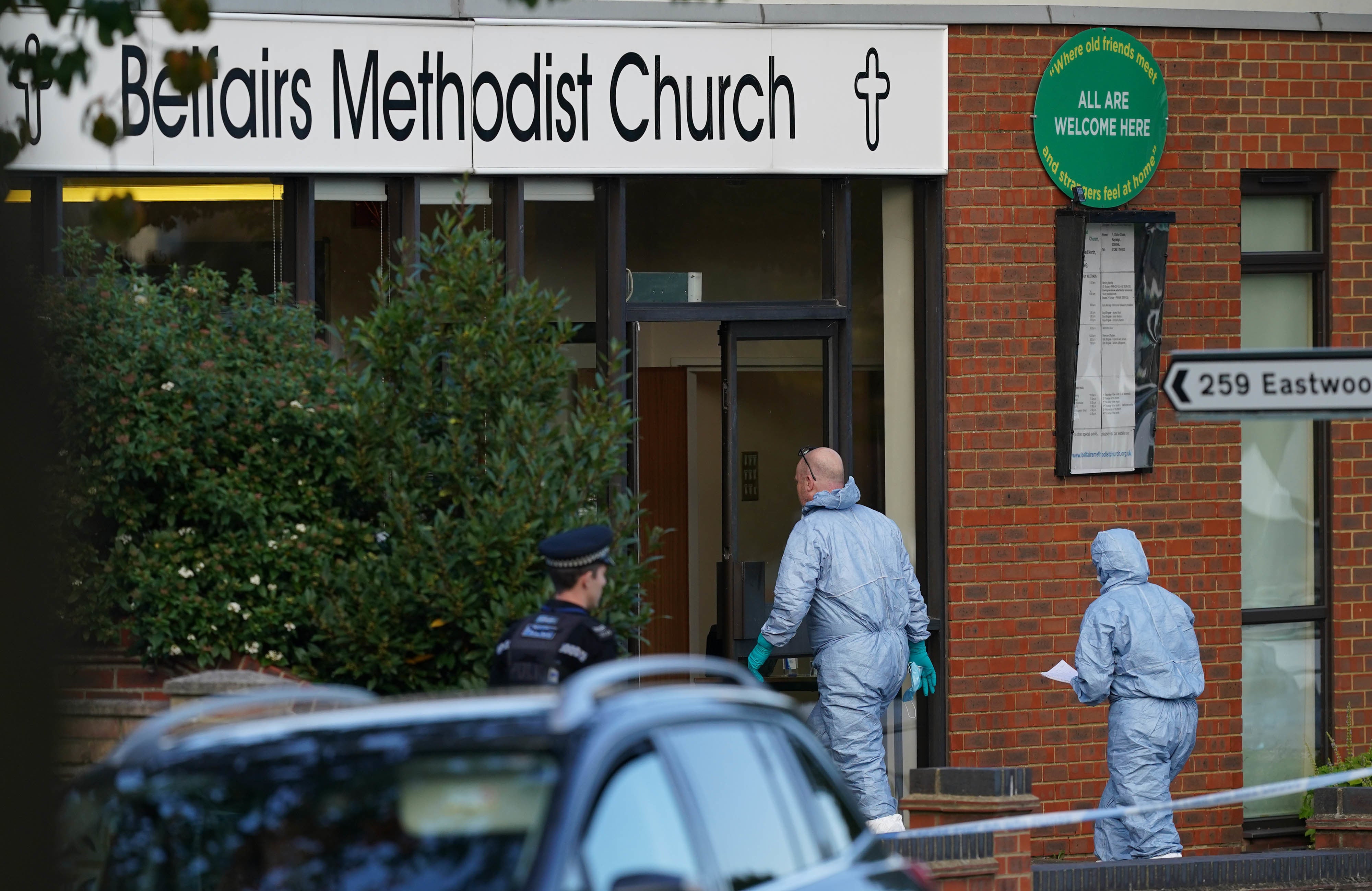 Forensic officers at the scene near the Belfairs Methodist Church after Sir David was killed