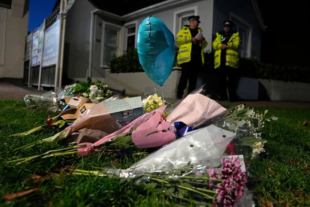 <p>Floral tributes are placed on one of the roads leading to the Belfairs Methodist Church</p>