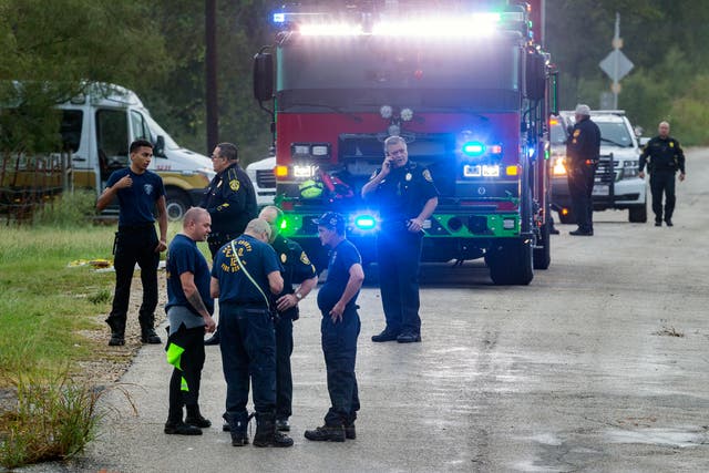 <p>Emergency personnel work at a flooded creek, Thursday, Oct. 14, 2021, in St. Hedwig, Texas, after the remnants of Hurricane Pamela swept away several cars and left two people missing.</p>