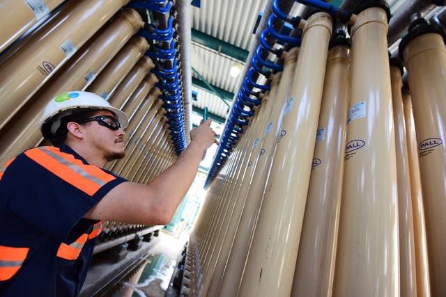 <p>A technician examines micro filter membranes at the West Basin Municipal Water District (WBMWD) water recycling facility in El Segundo, California. </p>