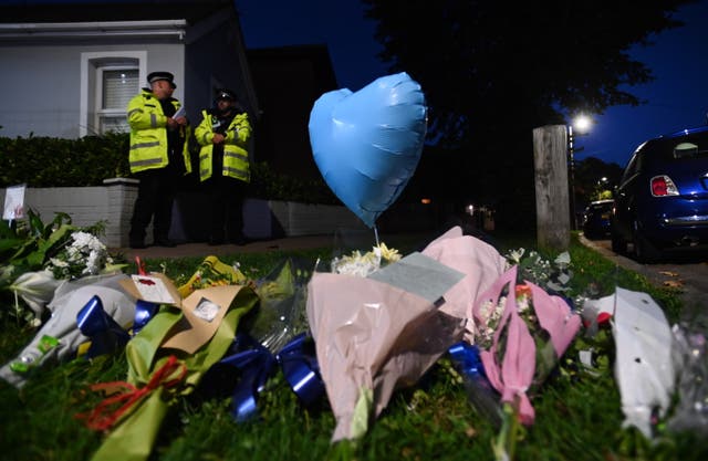 <p>Floral tributes at the scene where the MP for Southend West, Sir David Amess, was stabbed to death in Leigh-on-Sea</p>
