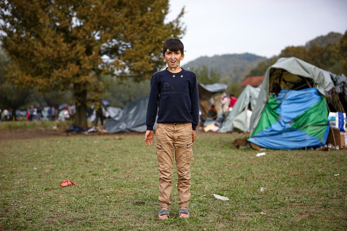 AP PHOTOS: Children brave the cold in makeshift Bosnian camp