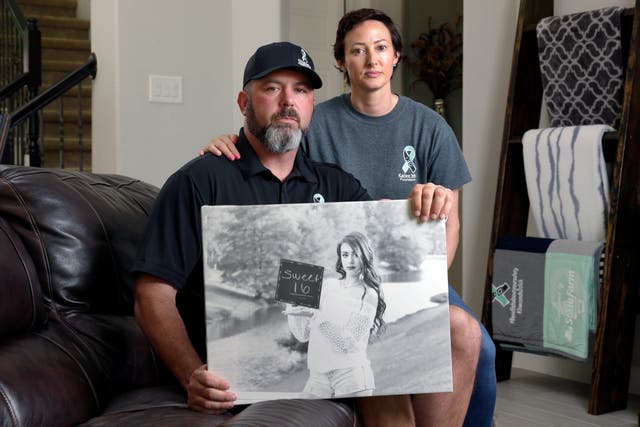 <p>In this Oct. 12, 2021, photo, David and Wendy Mills, parents of Kailee Mills who was killed four years ago in an automobile accident when riding in the back seat without a seat belt</p>