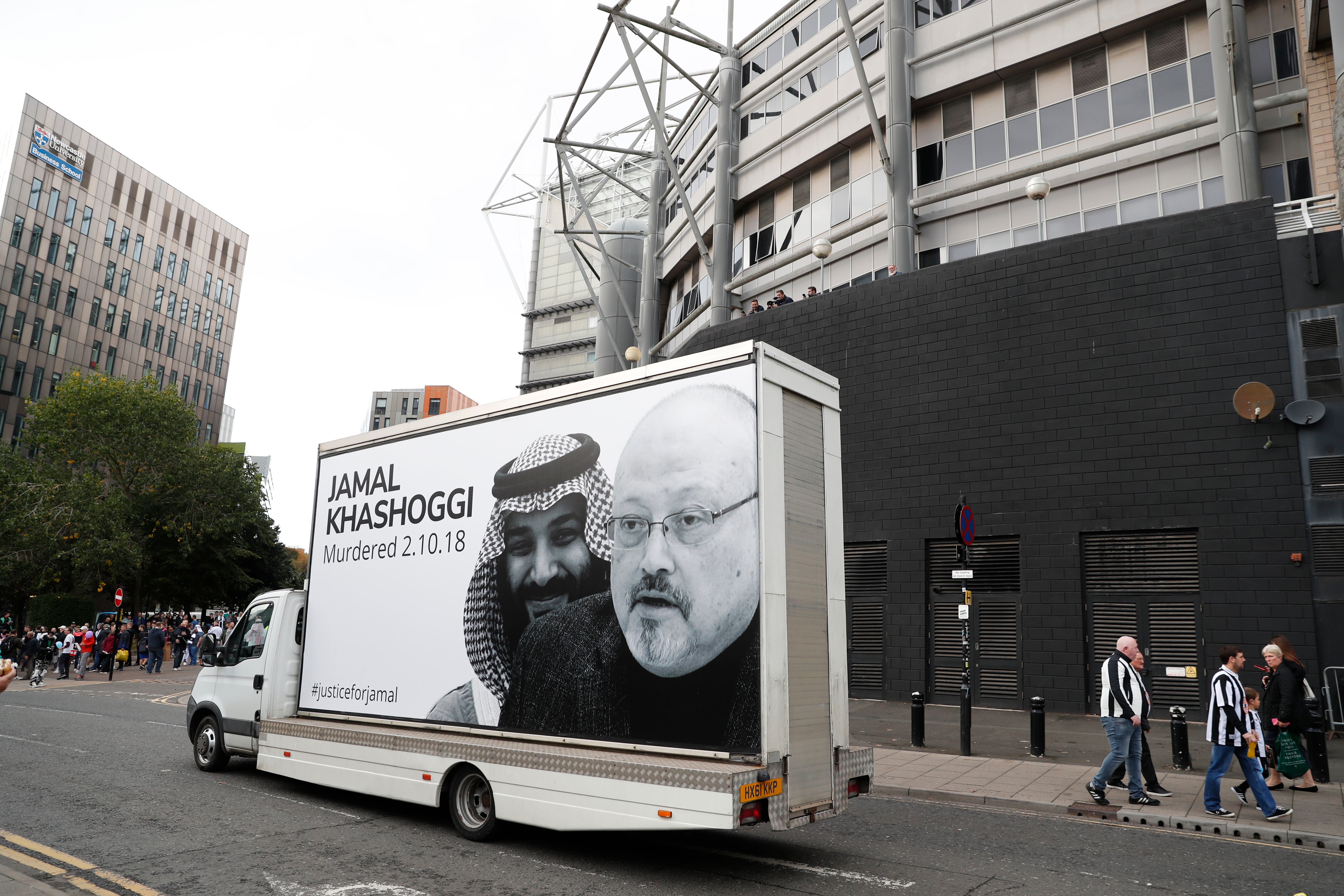 A van drives around the stadium bearing Jamal Khashoggi’s face
