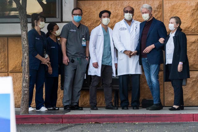<p>Former President Bill Clinton, and former first lady and former U.S. Secretary of State Hillary Clinton thank Alpesh N. Amin, MD, third from left, and the medical staff as he is released from the University of California Irvine Medical Center</p>