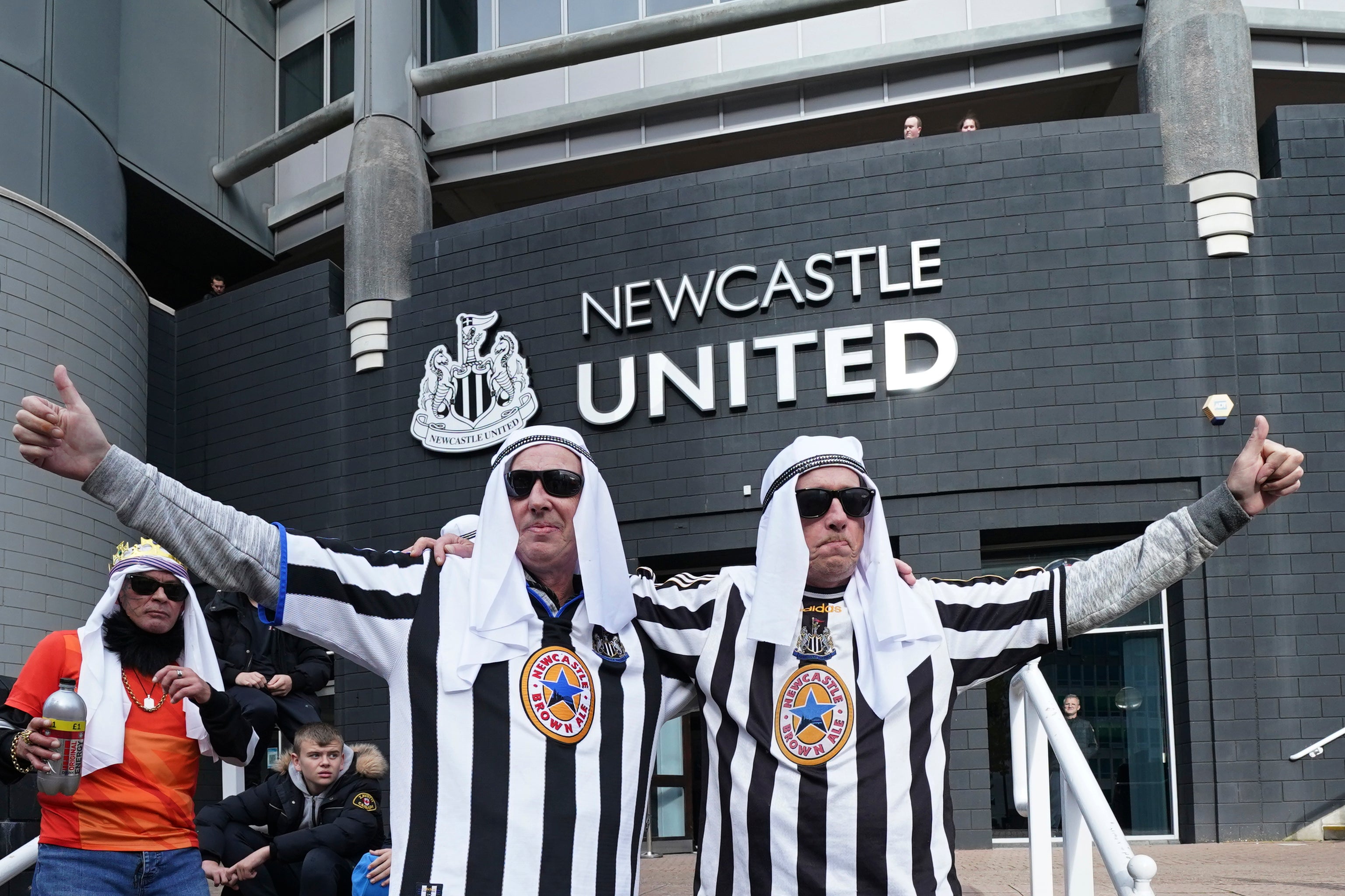 Newcastle fans celebrate the Saudi takeover