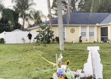 Brian Laundrie’s father emerges from house to tear down protest sign from lawn