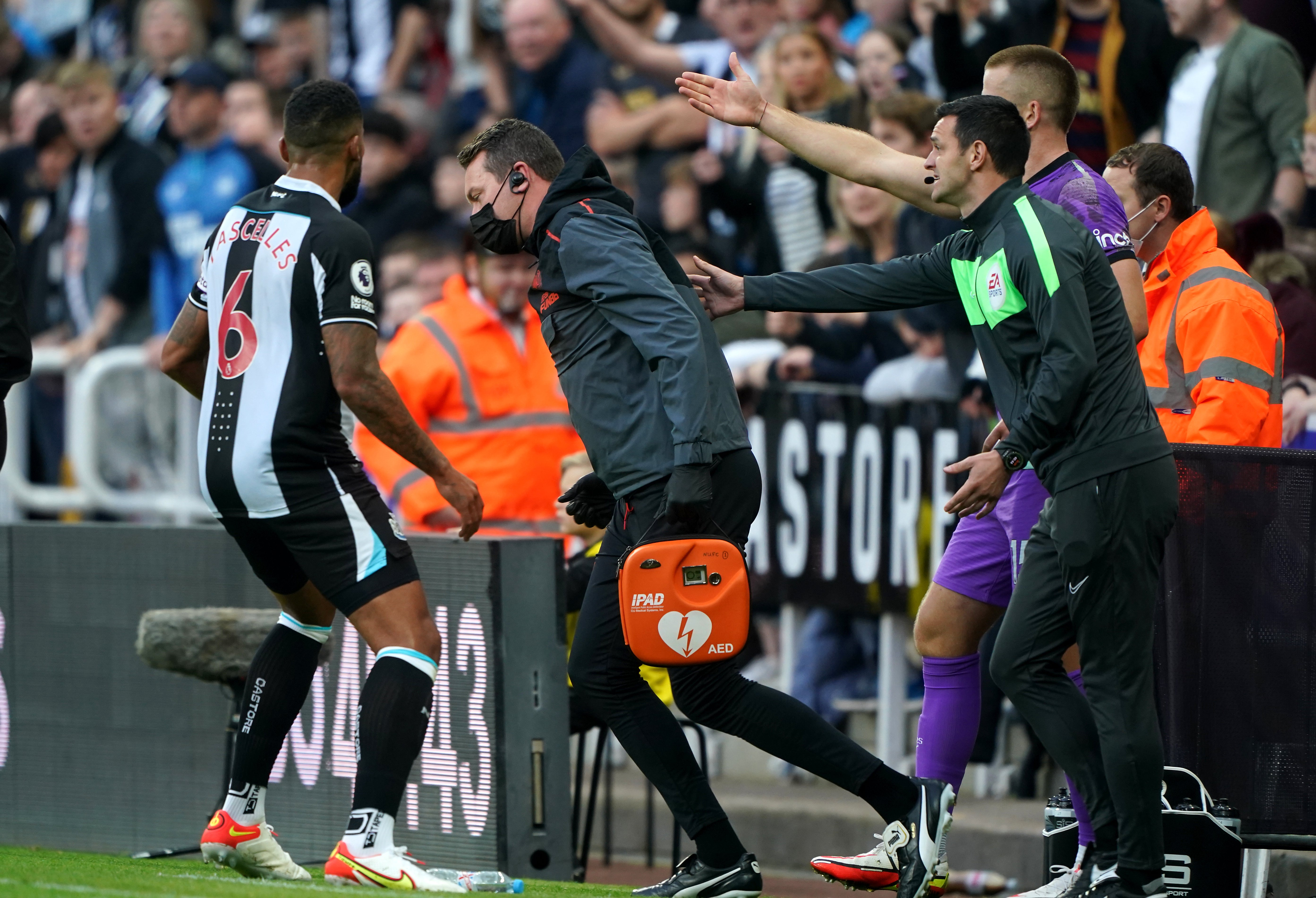 Newcastle United club doctor Paul Catterson (centre) was sent to attend to a fan who had taken ill in the stands (Owen Humphreys/PA)