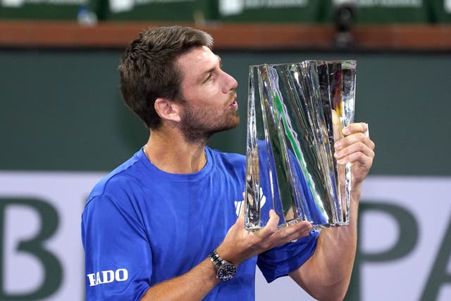 Britain’s Cameron Norrie kisses the trophy after defeating Nikoloz Basilashvili to take the BNP Paribas Open title (Mark J Terrill/AP)