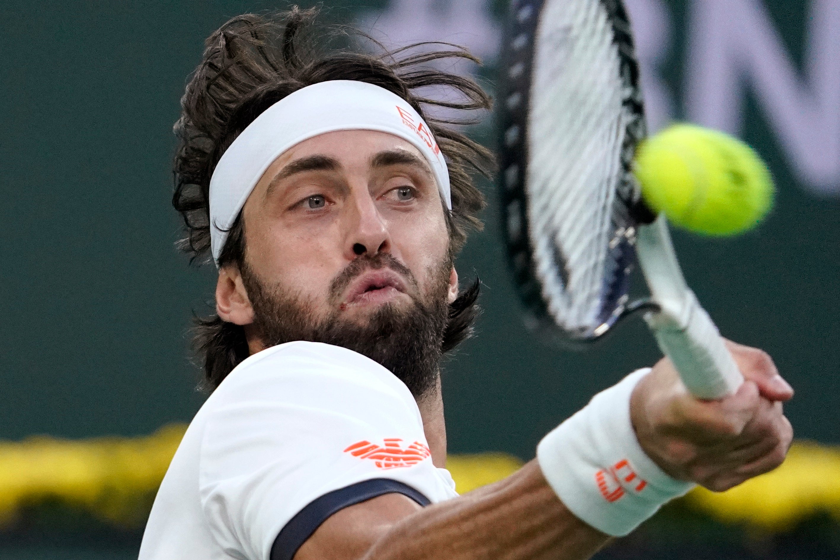 Nikoloz Basilashvili returns a forehand. The Georgian began in strong fashion but appeared to tire in the third set as Norrie clicked into gear (Mark J Terrill/AP)