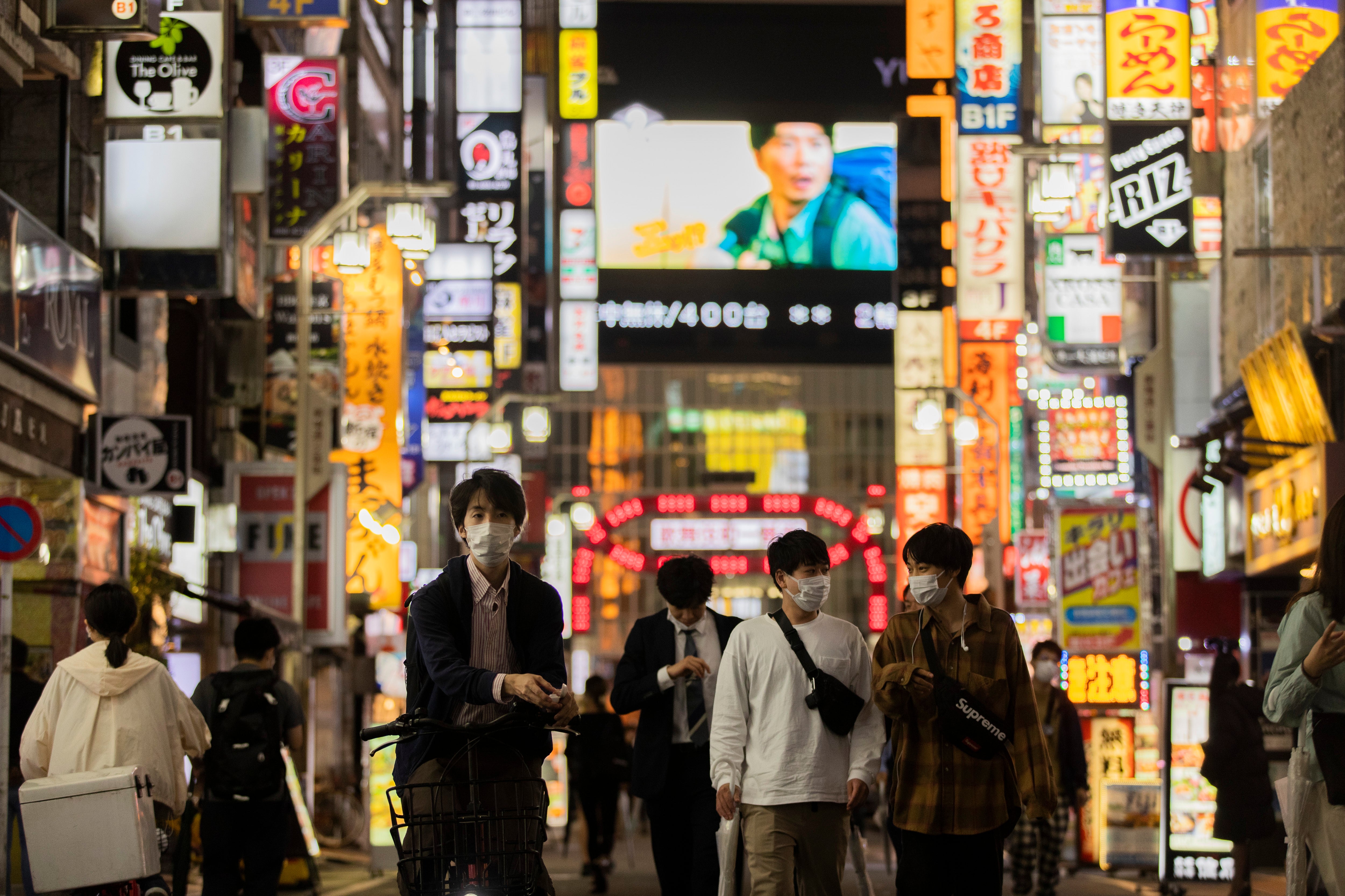 File photo: People walk through the famed Kabukicho entertainment district of Tokyo