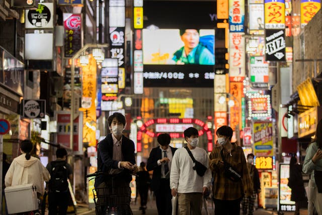 <p>File photo: People walk through the famed Kabukicho entertainment district of Tokyo</p>
