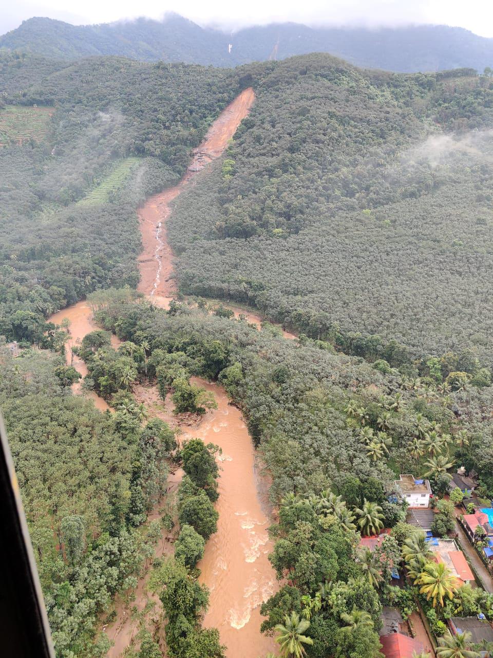 This photograph provided by the Indian Navy and taken from a naval helicopter shows the scene after a landslide triggered by heavy rains in the Western Ghats mountains at Koottickal in Kottayam district of Kerala