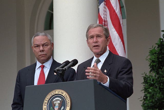 <p>Former US president George W Bush and late secretary of state Colin Powell, who has died</p>
