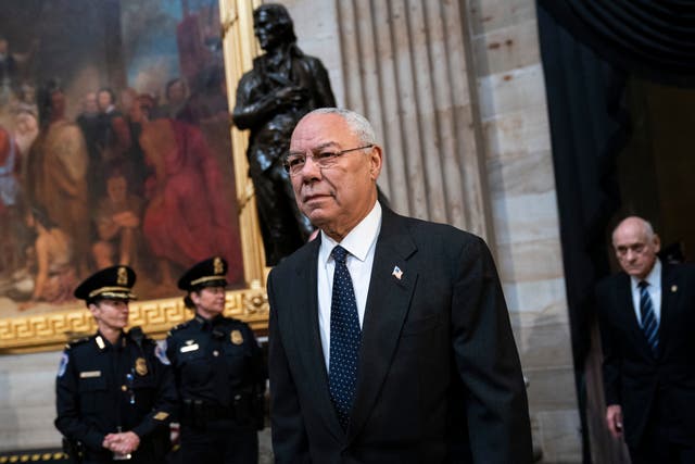 <p>Colin Powell arrives to pay his respects at the casket of the late former president George HW Bush as he lies in  in 2018 </p>