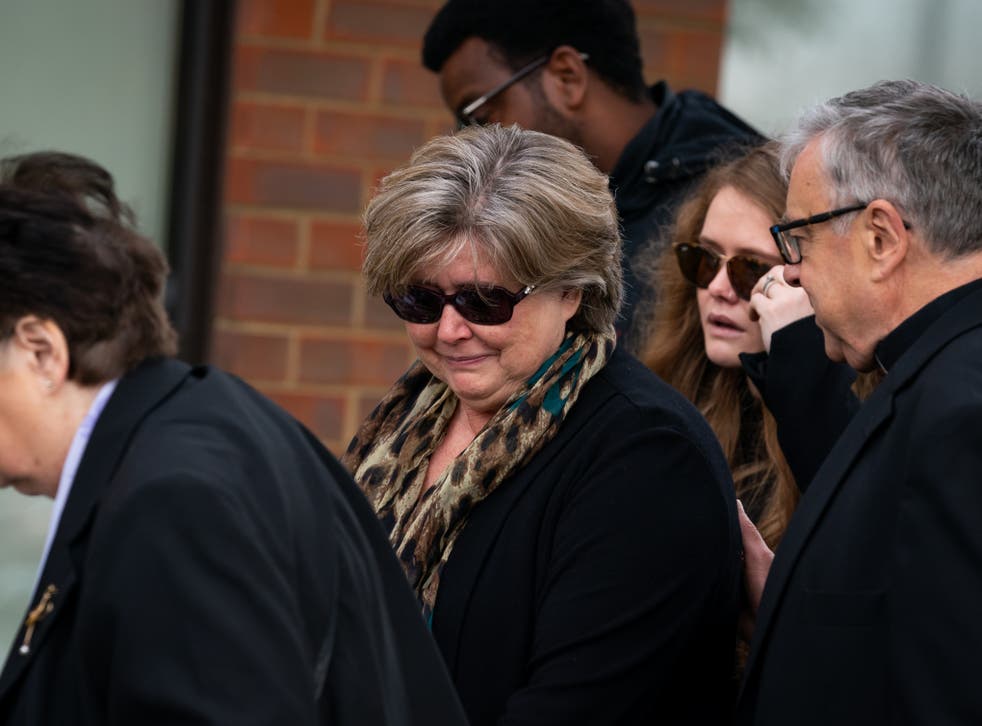 Julia Amess (centre) is pictured visiting tributes outside the murder scene of her late husband, the Tory MP Sir David Amess