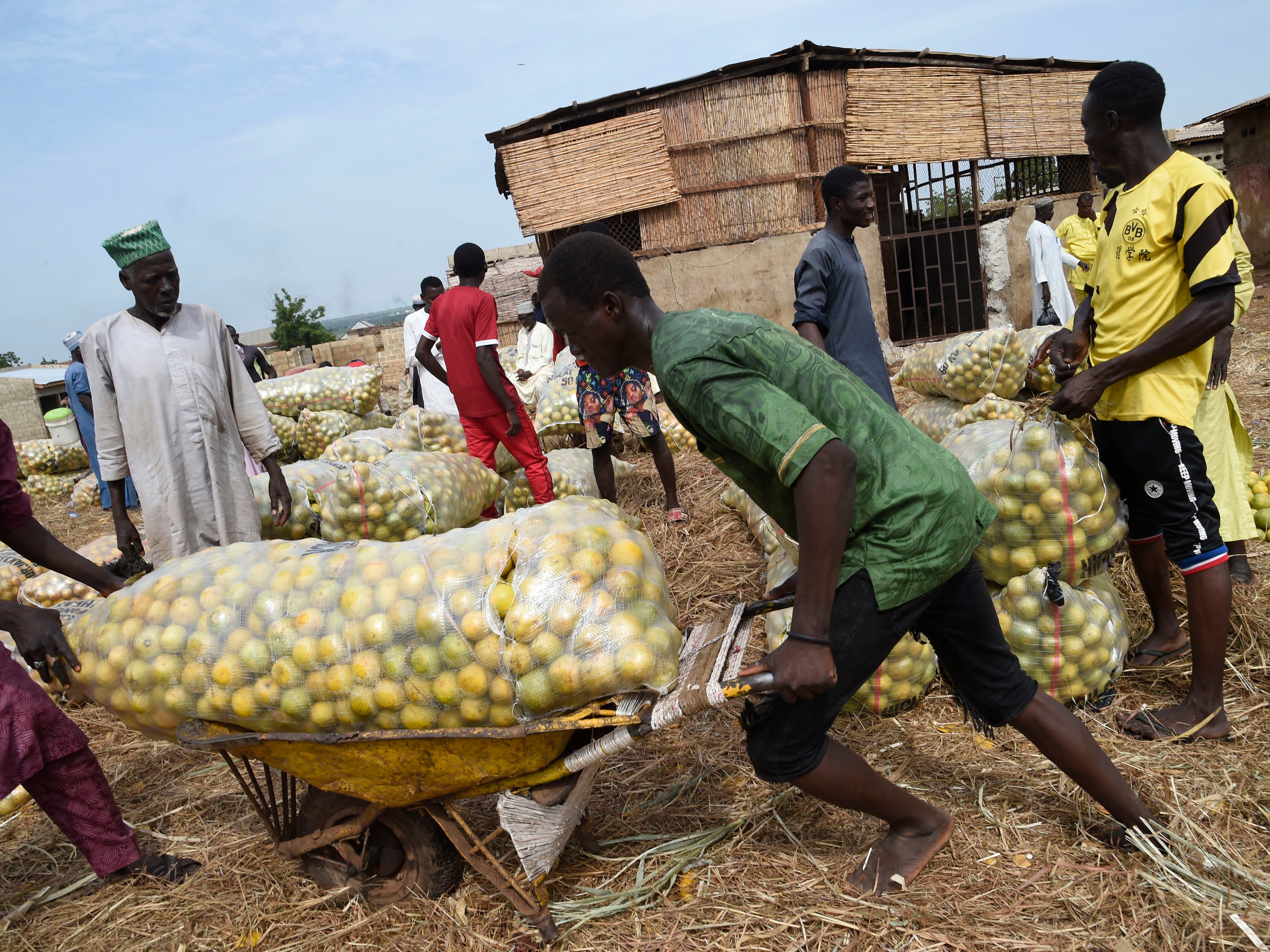 An unrelated image shows a market in Sokoto, which is facing a wave of attacks and kidnappings