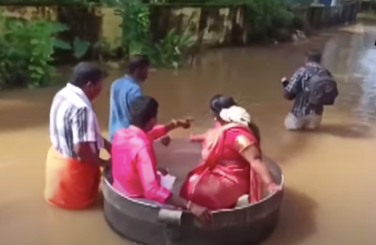 Kerala floods: Couple sail to wedding in large cooking pot