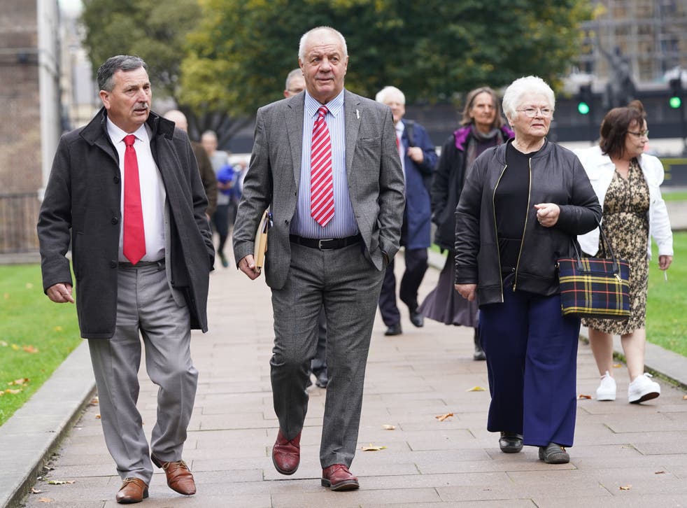 McCord (centre) leads victims of the Troubles and their families through Parliament Square, Westminster, on Tuesday