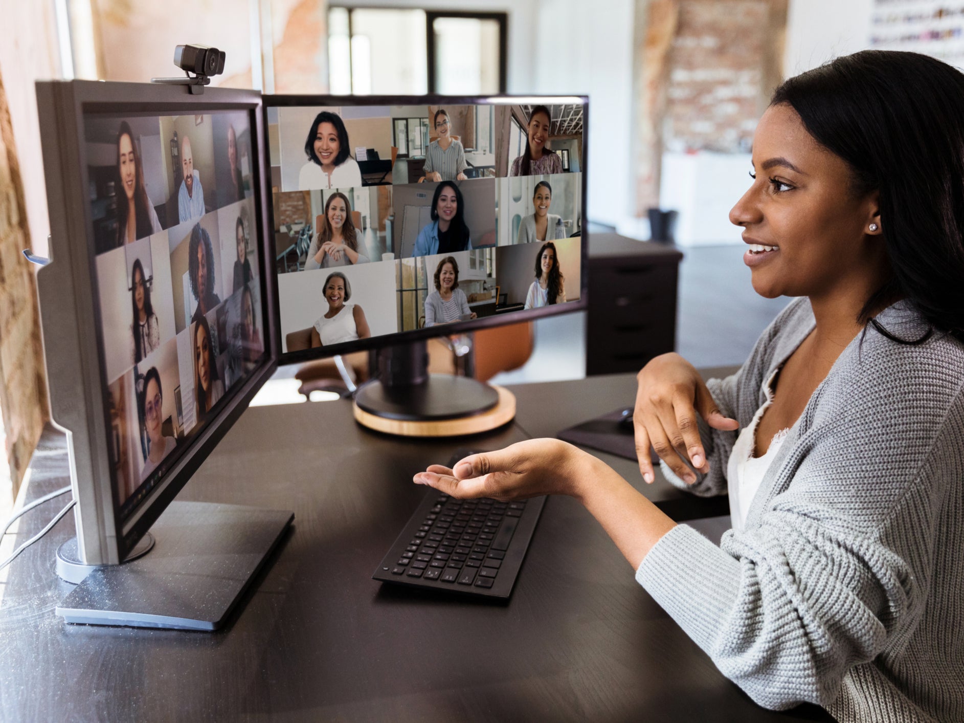 A young professional has a virtual meeting with colleagues