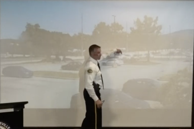 <p>Huntsville PD Deputy Chief Dewayne McCarver points out Ms Nance entering the police van</p>