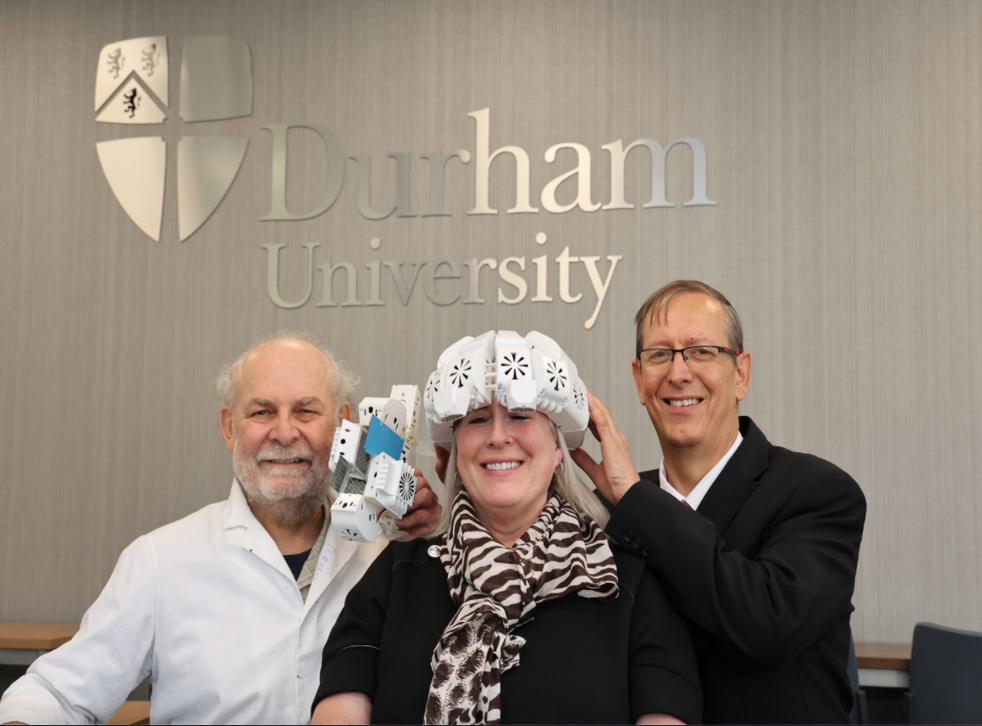 <p>Lead researcher Dr Paul Chazot (left), pictured with GP Dr Gordon Dougal, who devised the helmet and Tracy Sloan who used it to improve her memory</p>
