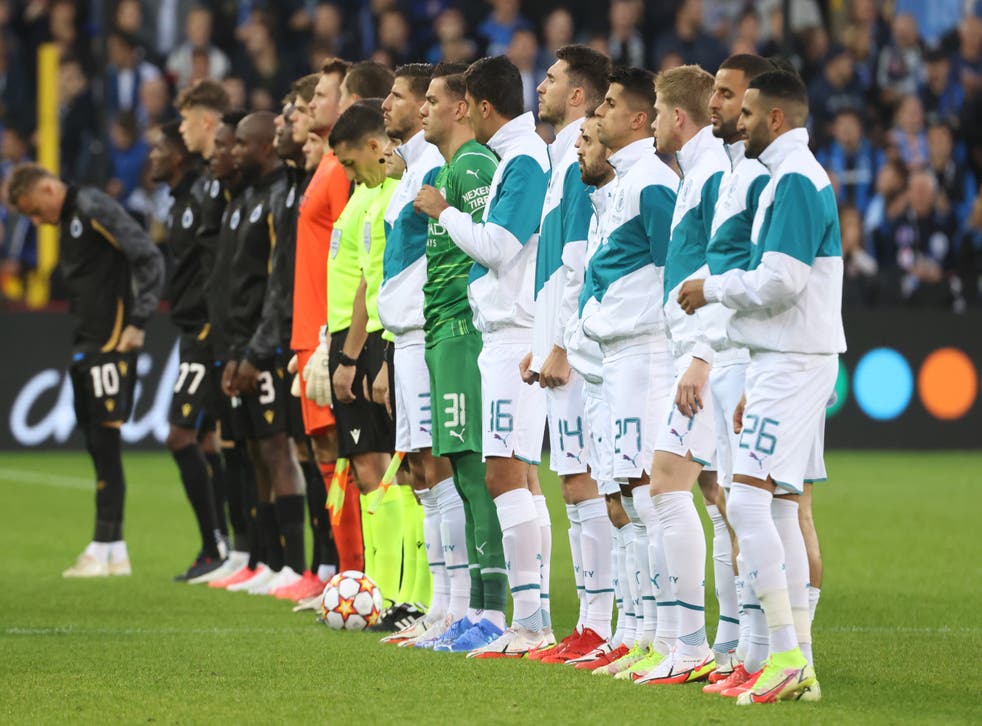 <p>The players line up before kick-off</p>