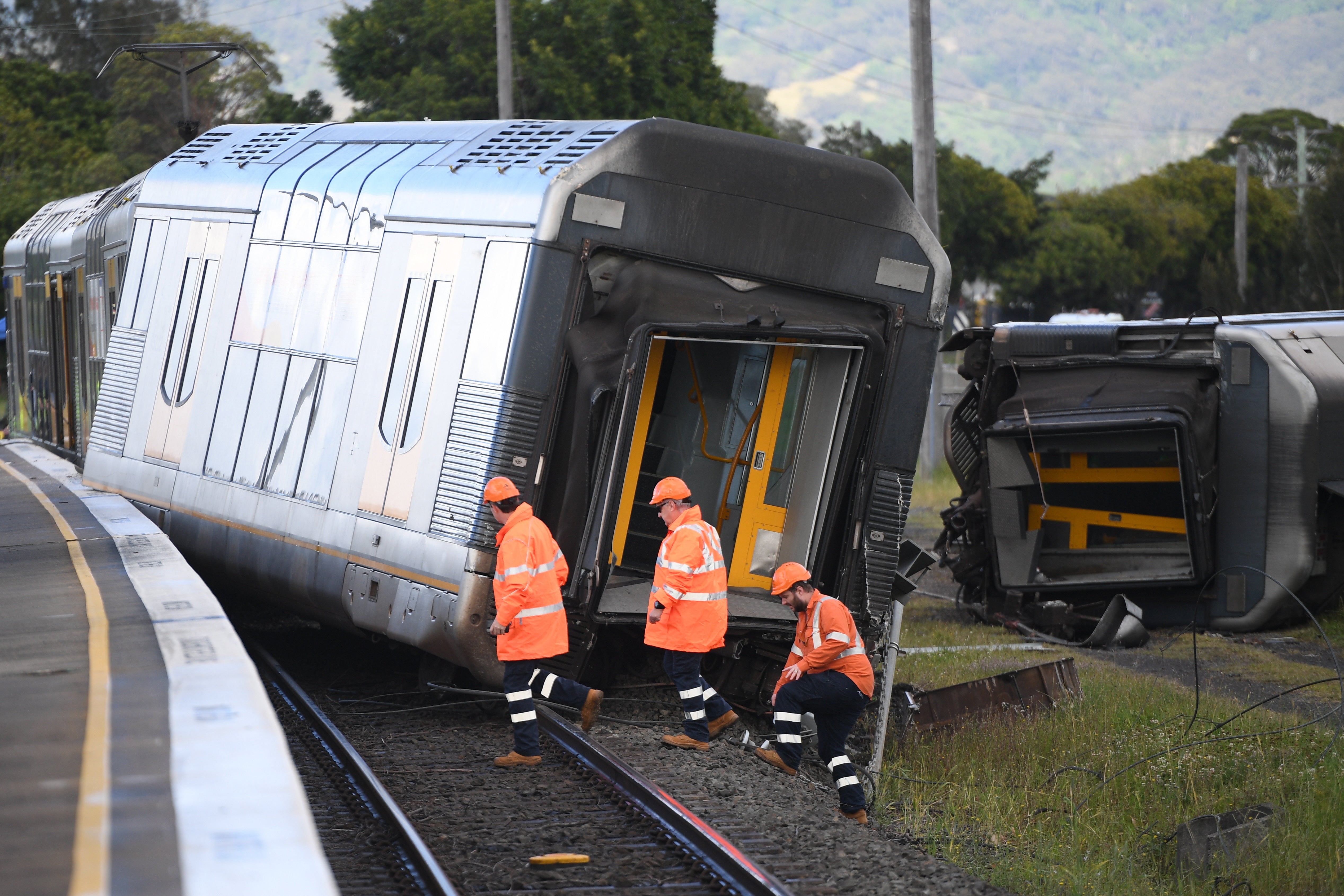 A derailed passenger train after it hit a car on a level crossing in Kembla Grange, New South Wales, Australia