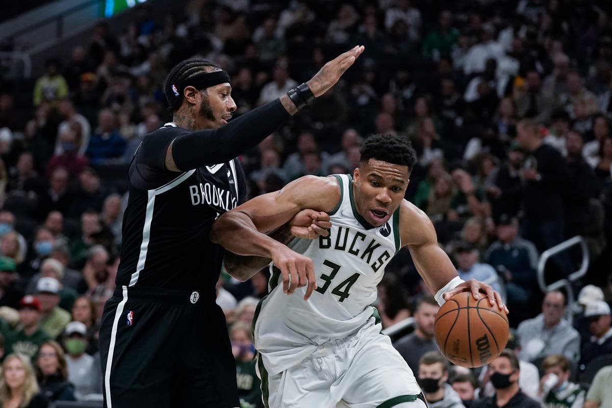 Milwaukee Bucks surge to NBA opening day victory over Kyrie Irving-less ...