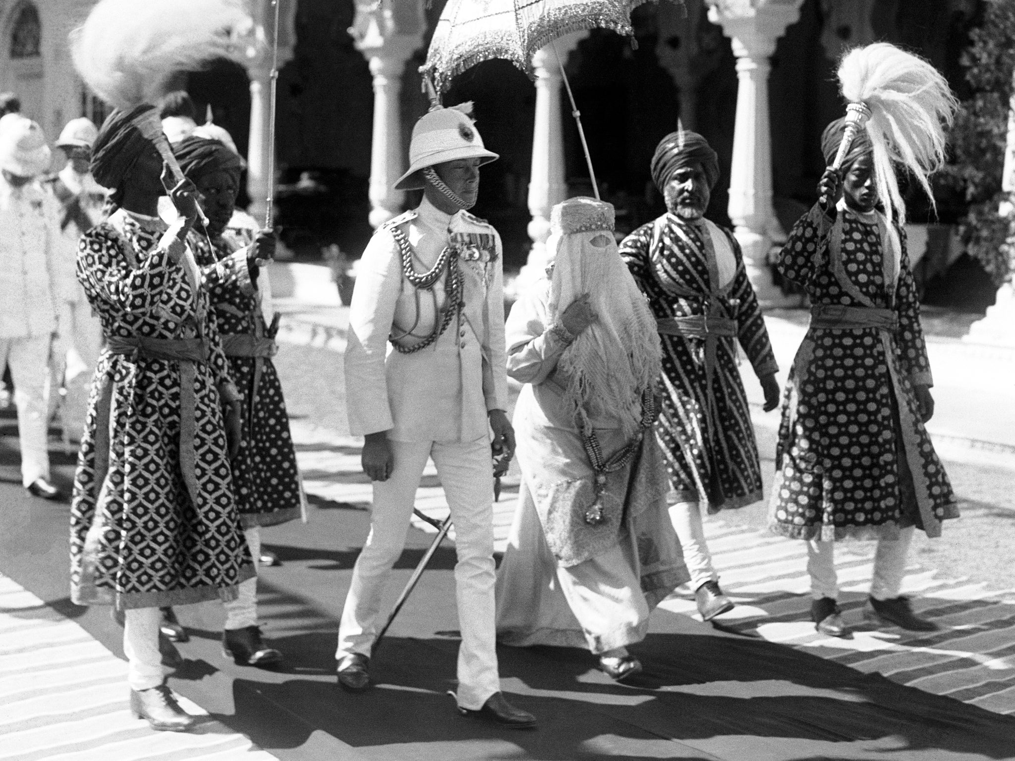 The Prince of Wales and her Highness the begum of Bhopal walk to the Durbar hall at the Sadar Manzil palace in Bhodar