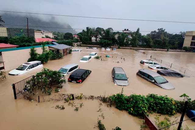<p>Submerged cars are seen at a flooded hotel resort as extreme rainfall caused the Kosi River to overflow at the Jim Corbett National Park in Uttarakhand, India on Tuesday </p>