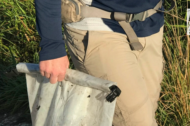 <p>A dry bag containing Brian Laundrie’s notebook is removed from the Myakkahatchee Creek Environmental Park on 20 October </p>