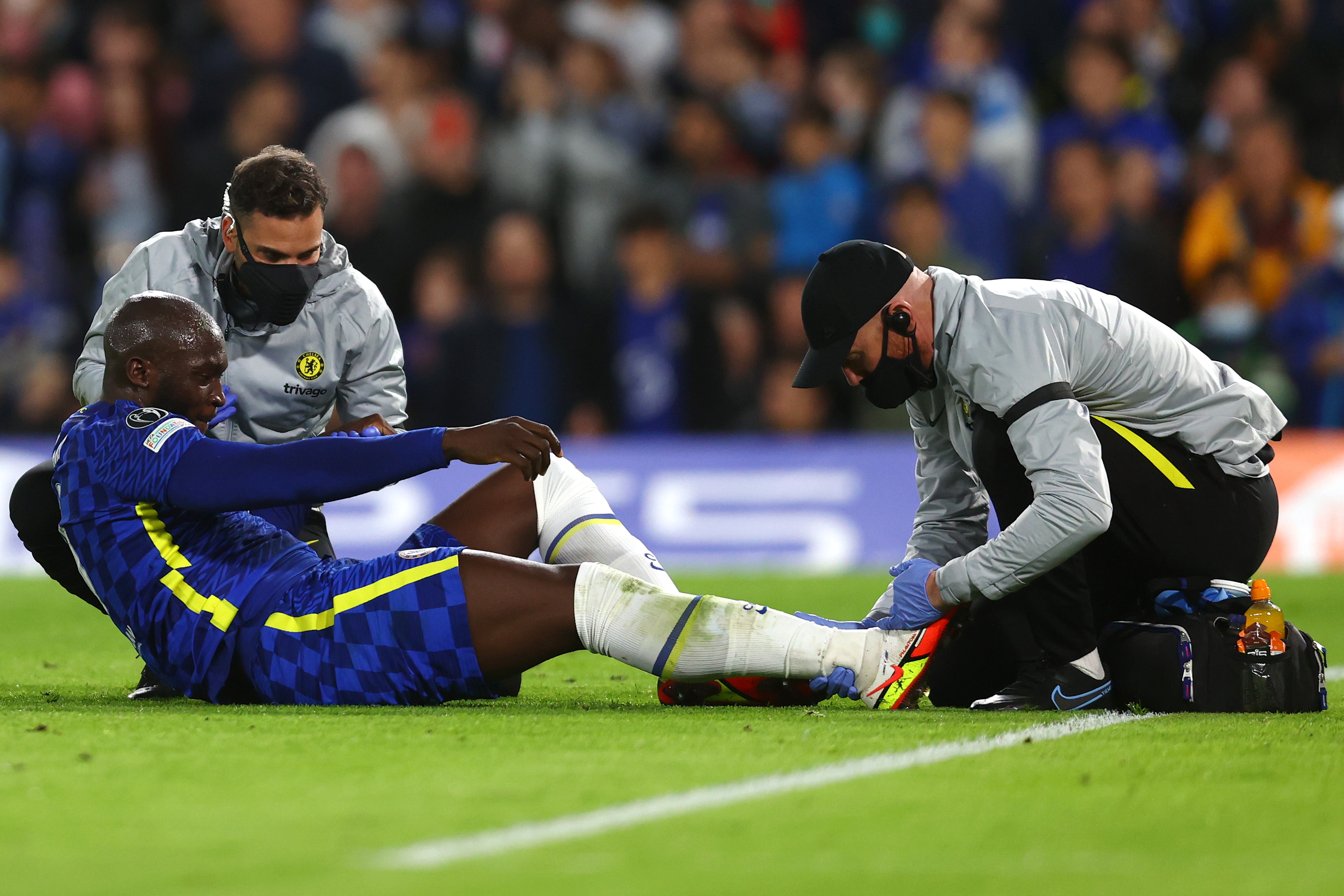 Romelu Lukaku receives treatment before being substituted in the first half
